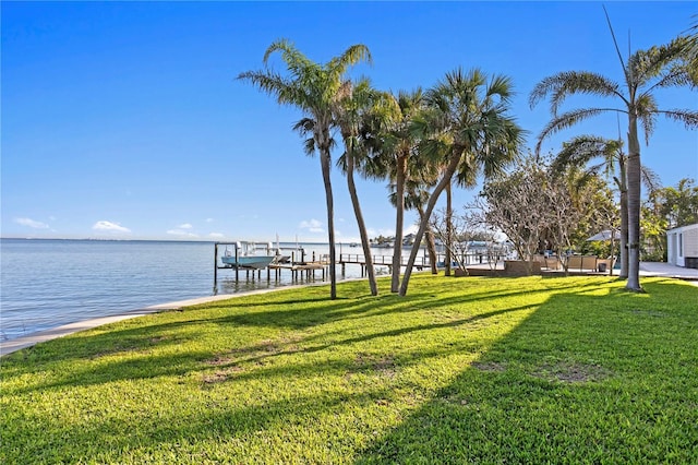 exterior space with a lawn and a water view