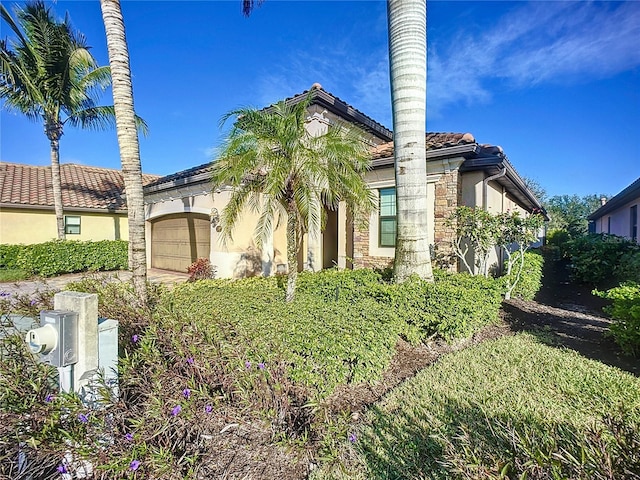 view of side of property featuring a garage