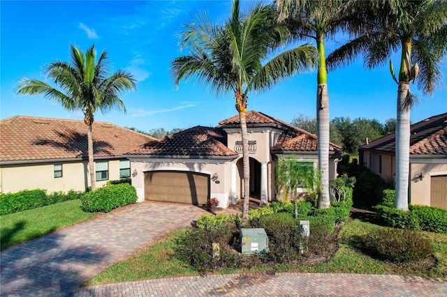 mediterranean / spanish house with a garage