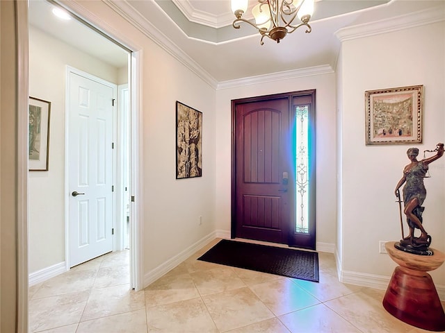 entryway with an inviting chandelier, ornamental molding, and plenty of natural light