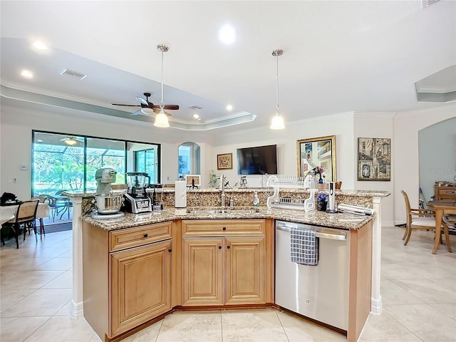 kitchen featuring a kitchen island with sink, sink, light stone counters, and stainless steel dishwasher