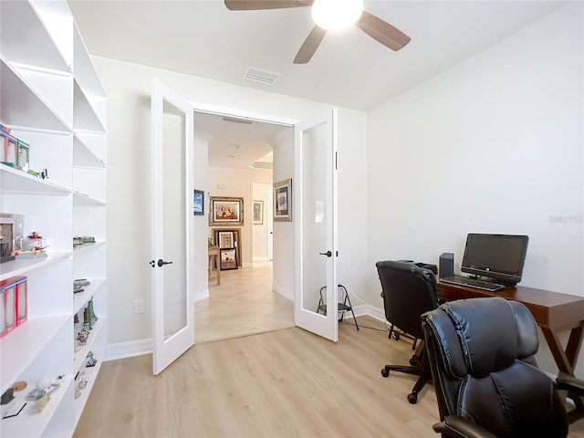 home office with ceiling fan, light wood-type flooring, and french doors