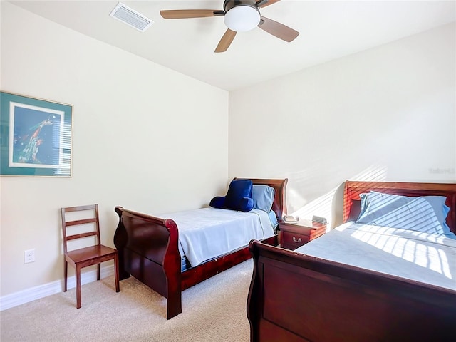 bedroom with light carpet and ceiling fan