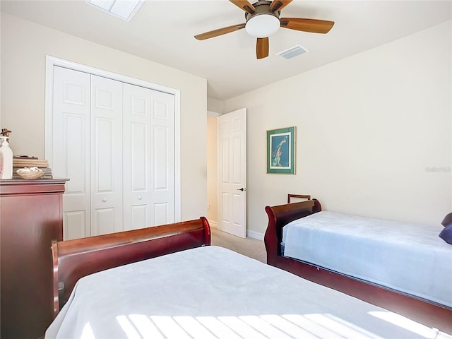 bedroom featuring carpet floors, a closet, and ceiling fan