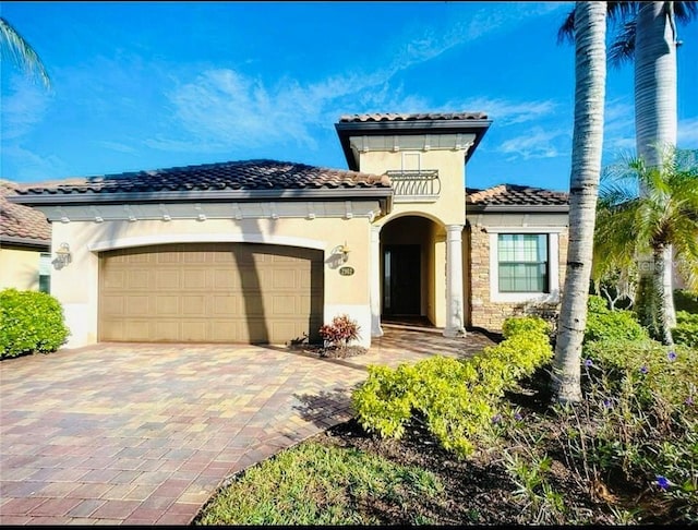 mediterranean / spanish-style home with a garage