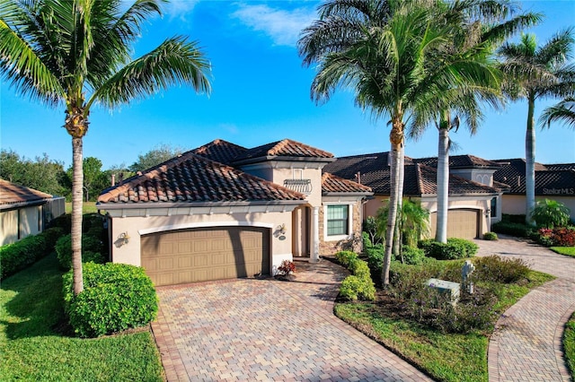 mediterranean / spanish house featuring a garage