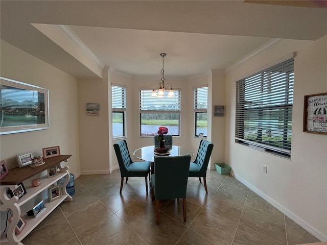 tiled dining area featuring an inviting chandelier, crown molding, and a healthy amount of sunlight