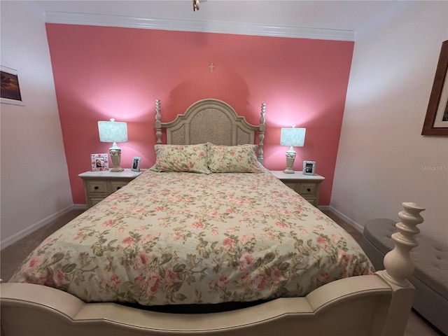 bedroom featuring crown molding and carpet flooring