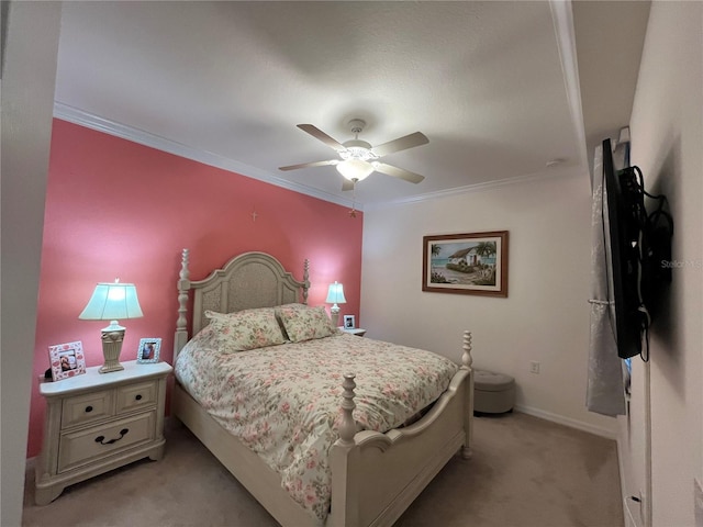 bedroom featuring crown molding, ceiling fan, and light carpet