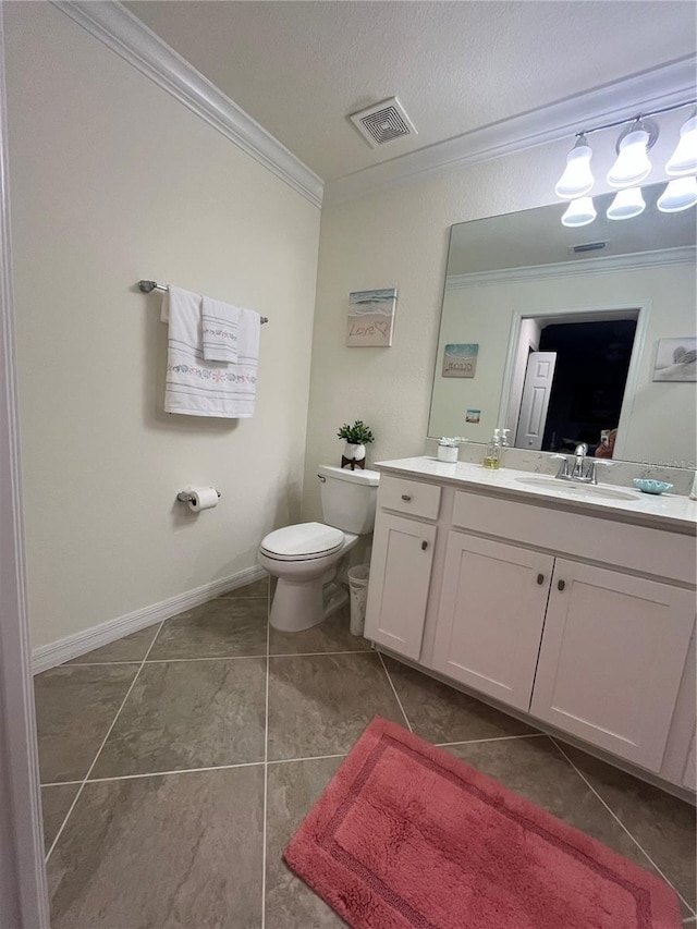 bathroom with tile patterned flooring, ornamental molding, vanity, toilet, and a textured ceiling