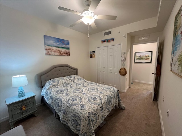 carpeted bedroom with a closet and ceiling fan