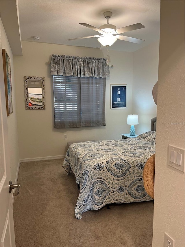 bedroom with carpet floors, baseboards, and a ceiling fan