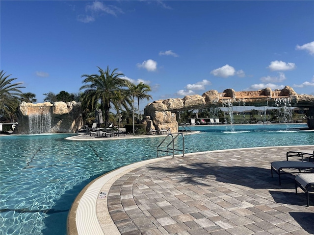 community pool featuring a patio area