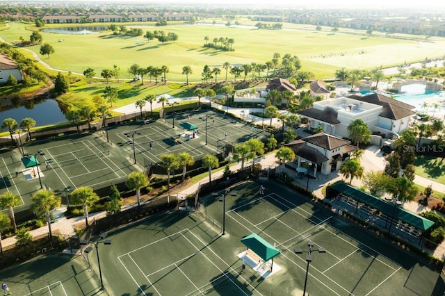 drone / aerial view featuring a water view and golf course view