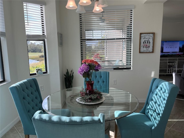 17520 Gawthrop Dr Unit 106, Lakewood Ranch, FL 34211 - dining area with baseboards, tile patterned floors, and plenty of natural light