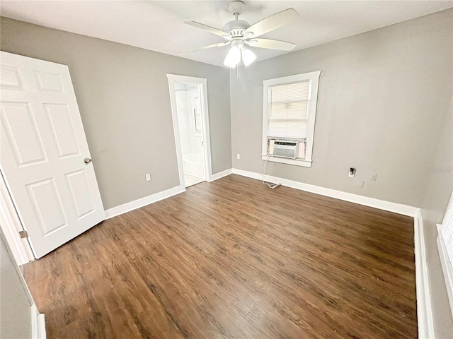 unfurnished bedroom featuring ensuite bathroom, cooling unit, ceiling fan, and dark hardwood / wood-style flooring