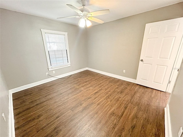 spare room with hardwood / wood-style flooring and ceiling fan