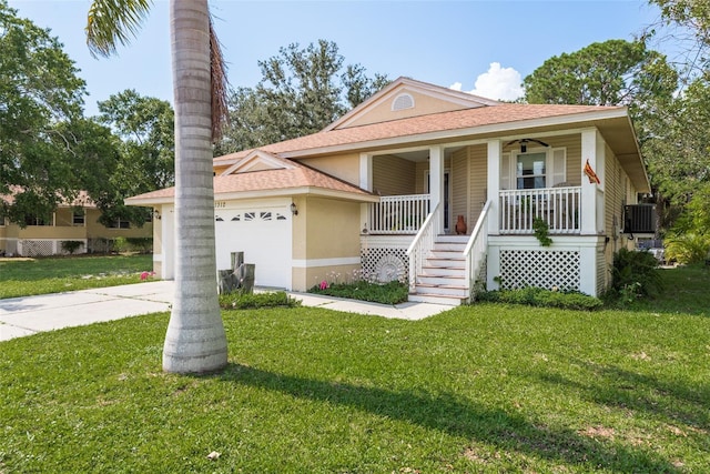 view of front of house featuring central AC, a garage, covered porch, and a front yard