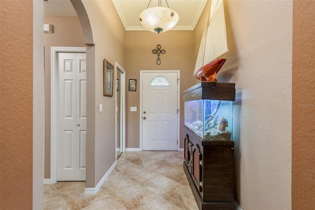 doorway to outside featuring crown molding