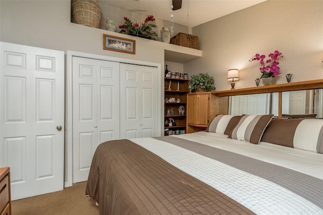 carpeted bedroom featuring a closet