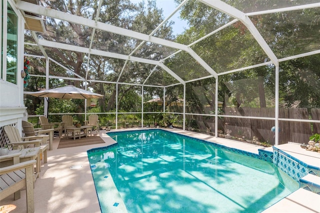 view of pool with a lanai and a patio