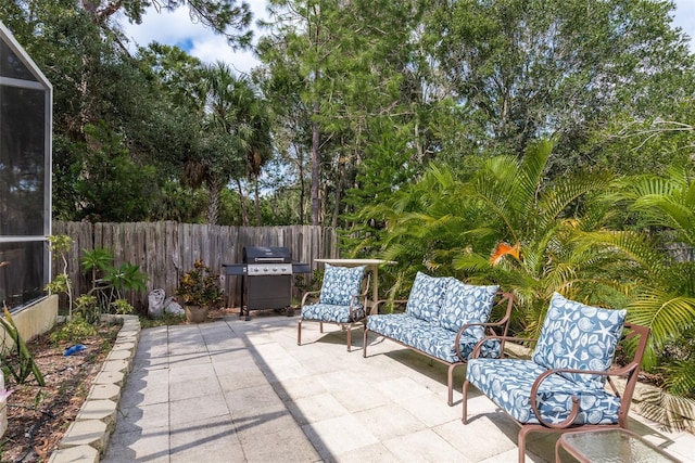 view of patio featuring a grill