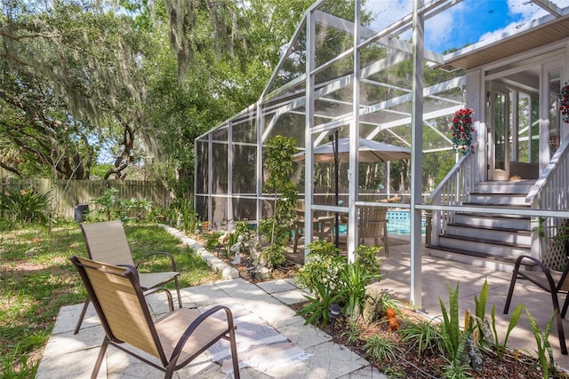 view of patio / terrace with glass enclosure