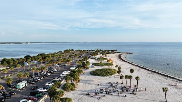 bird's eye view featuring a water view and a beach view