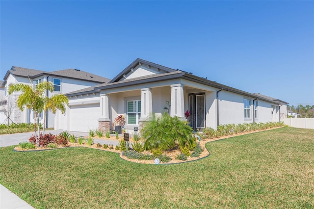 view of front of property featuring a garage and a front lawn