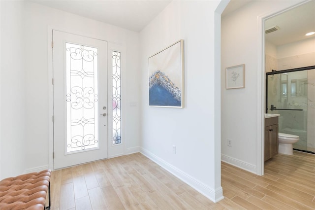 entrance foyer with light hardwood / wood-style floors