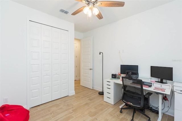 office area featuring light hardwood / wood-style floors and ceiling fan