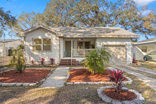 ranch-style home with a garage and a porch