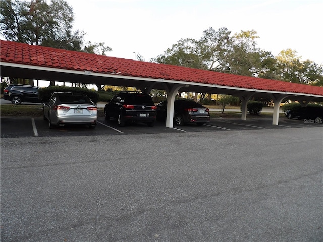 view of vehicle parking featuring a carport