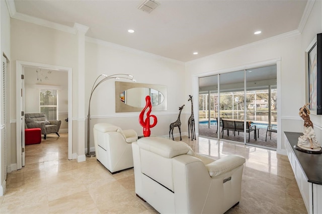 living room with ornamental molding and a healthy amount of sunlight