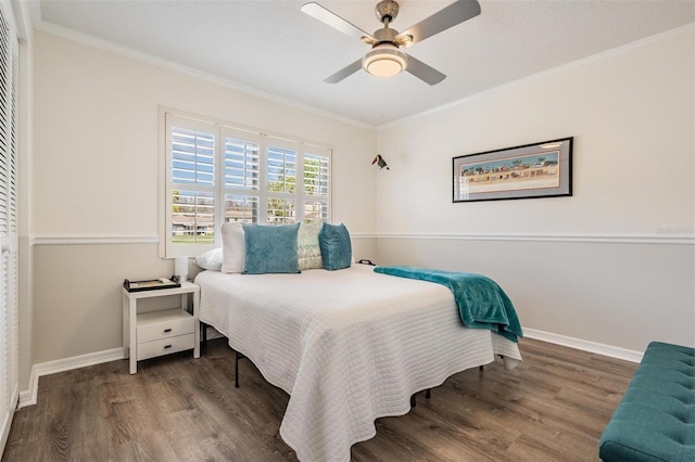 bedroom with ornamental molding, ceiling fan, and dark hardwood / wood-style flooring