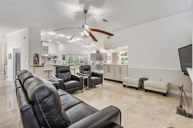 living room featuring crown molding, lofted ceiling, and ceiling fan