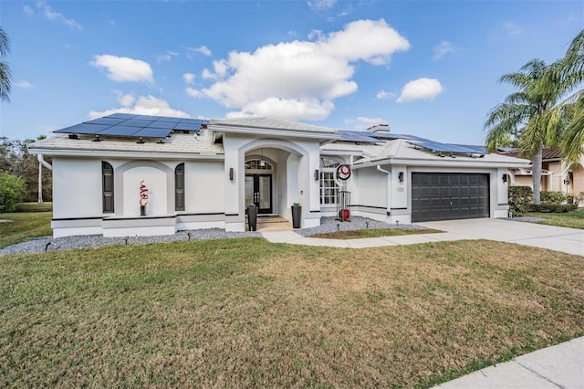 view of front facade featuring a garage and a front lawn