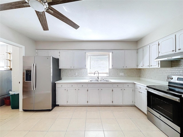 kitchen with stainless steel appliances, white cabinetry, sink, and tasteful backsplash