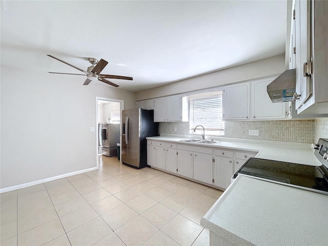 kitchen with sink, stainless steel appliances, exhaust hood, and white cabinets