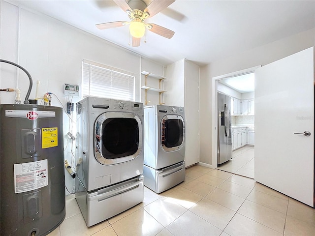 laundry area featuring ceiling fan, washing machine and clothes dryer, water heater, and light tile patterned floors