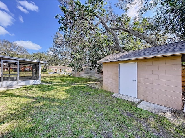 view of yard with a sunroom