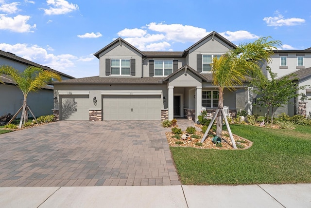 view of front facade featuring a garage and a front lawn