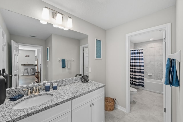 full bathroom with vanity, shower / bath combination with curtain, and toilet