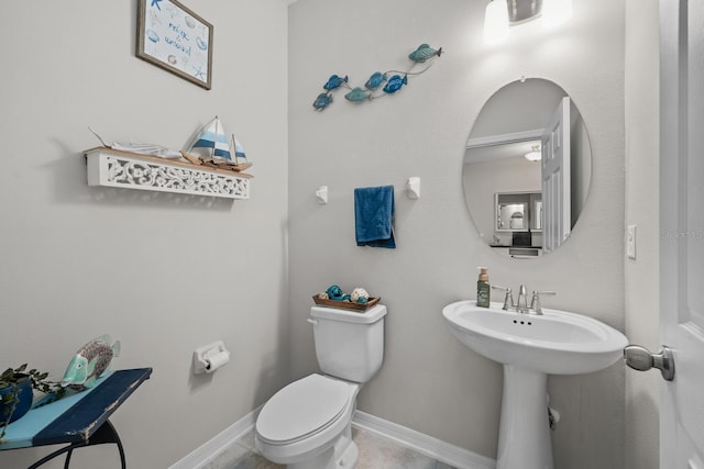 bathroom featuring toilet and sink