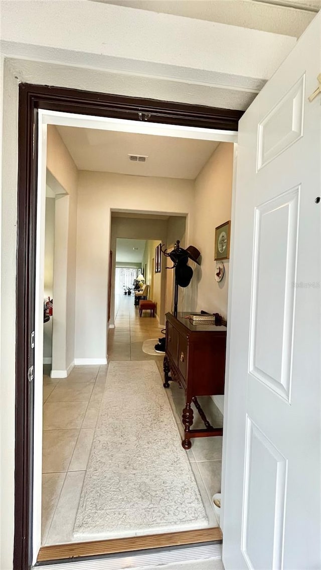 10854 Sage Canyon Dr, Riverview, FL 33578 - corridor with visible vents, baseboards, and tile patterned floors
