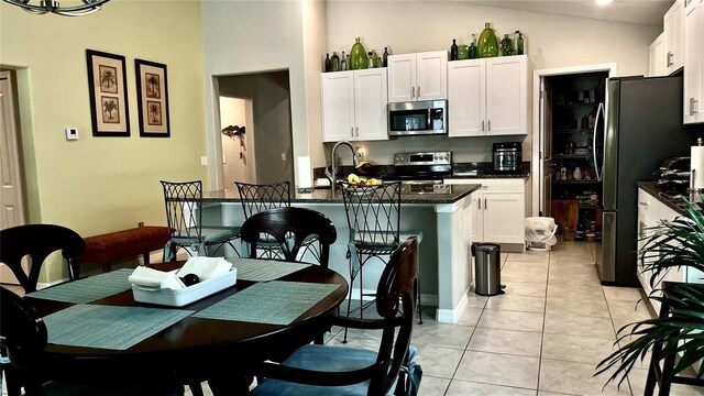 10854 Sage Canyon Dr, Riverview, FL 33578 - kitchen with appliances with stainless steel finishes, white cabinetry, and light tile patterned floors