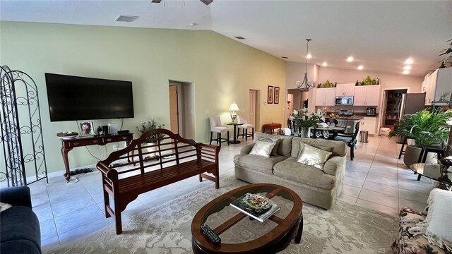 10854 Sage Canyon Dr, Riverview, FL 33578 - living room with lofted ceiling, ceiling fan, light tile patterned floors, and visible vents