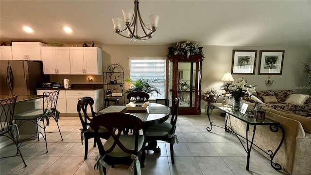 10854 Sage Canyon Dr, Riverview, FL 33578 - dining area featuring a notable chandelier and light tile patterned floors