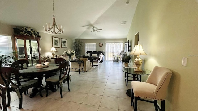 10854 Sage Canyon Dr, Riverview, FL 33578 - dining area with ceiling fan with notable chandelier, lofted ceiling, visible vents, and light tile patterned floors