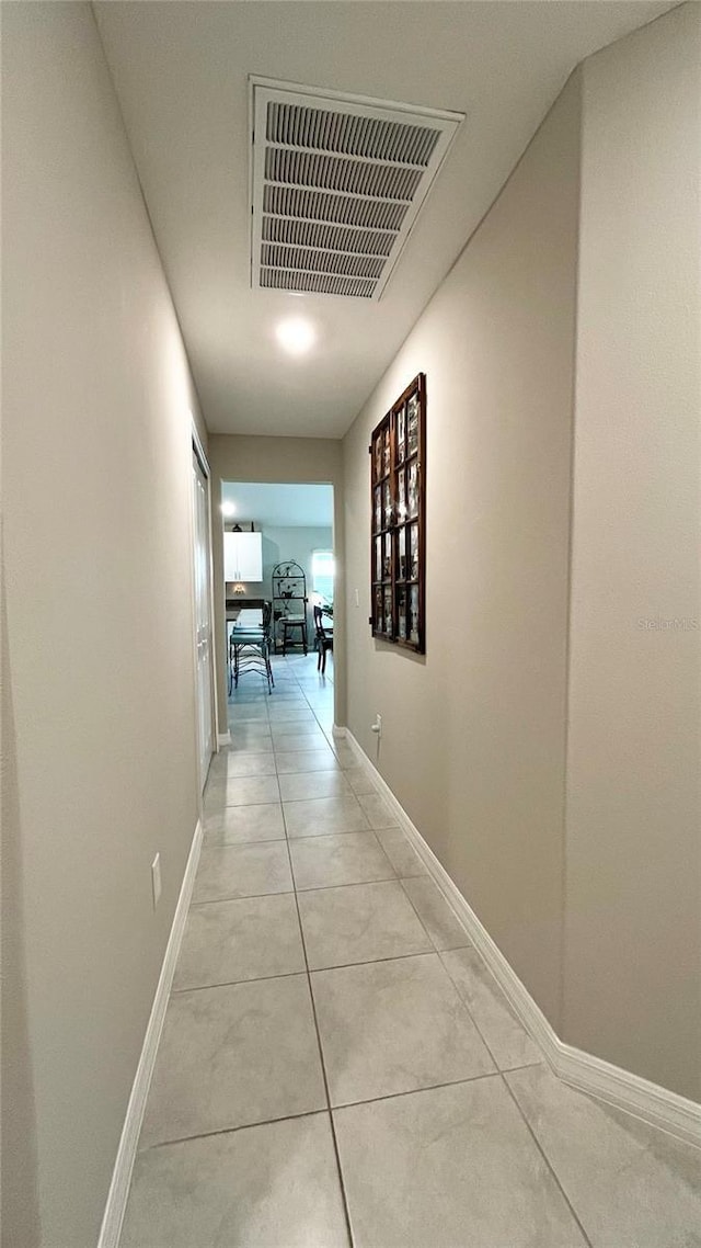 10854 Sage Canyon Dr, Riverview, FL 33578 - hallway with light tile patterned floors, visible vents, and baseboards
